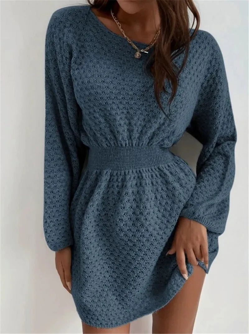 Blue women's knitted dress with crocheted flower details, round neck, fitted waist, and long sleeves.