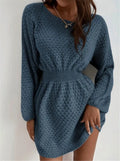 Blue women's knitted dress with crocheted flower details, round neck, fitted waist, and long sleeves.