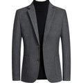 A grey slim-fit men's wool suit blazer with a non-ironing finish for autumn wear.