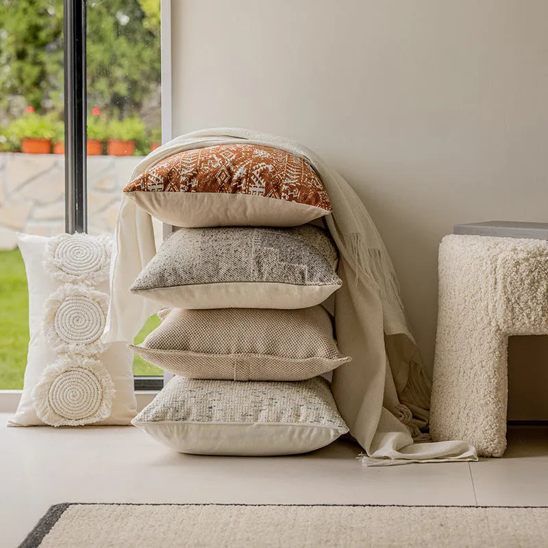 Red coffee brown square cushion with PP cotton filler on a grey sofa.