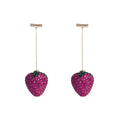 Red strawberry charm stud earrings with spot drill finish on zinc alloy.