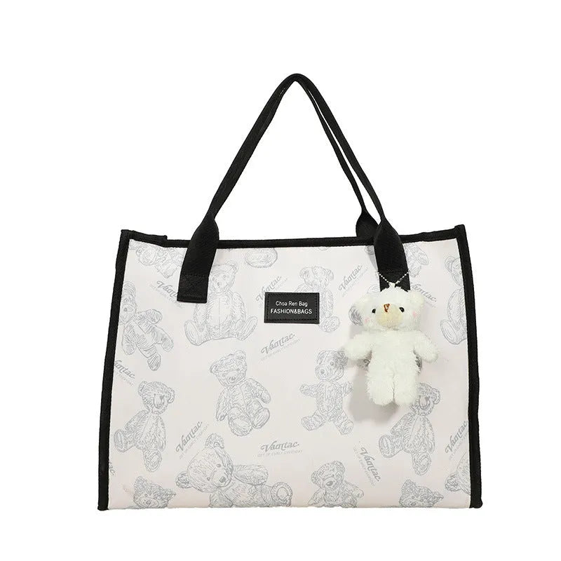 Women's black canvas tote bag with rhombus pattern and sandwich pocket compartments