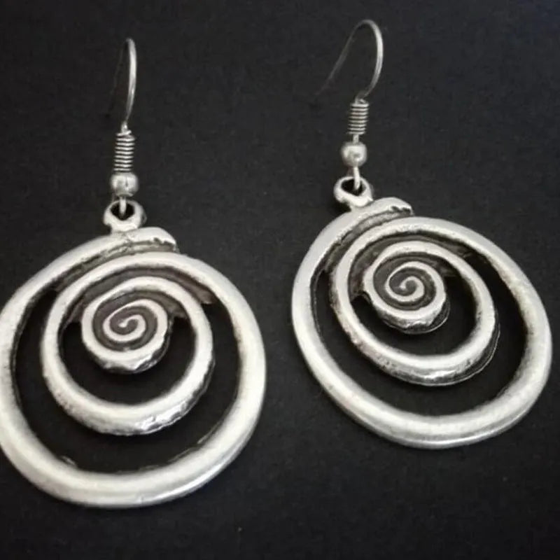 Silver geometric spiral distressed earrings with retro design measuring 2.6 by 5 centimetres
