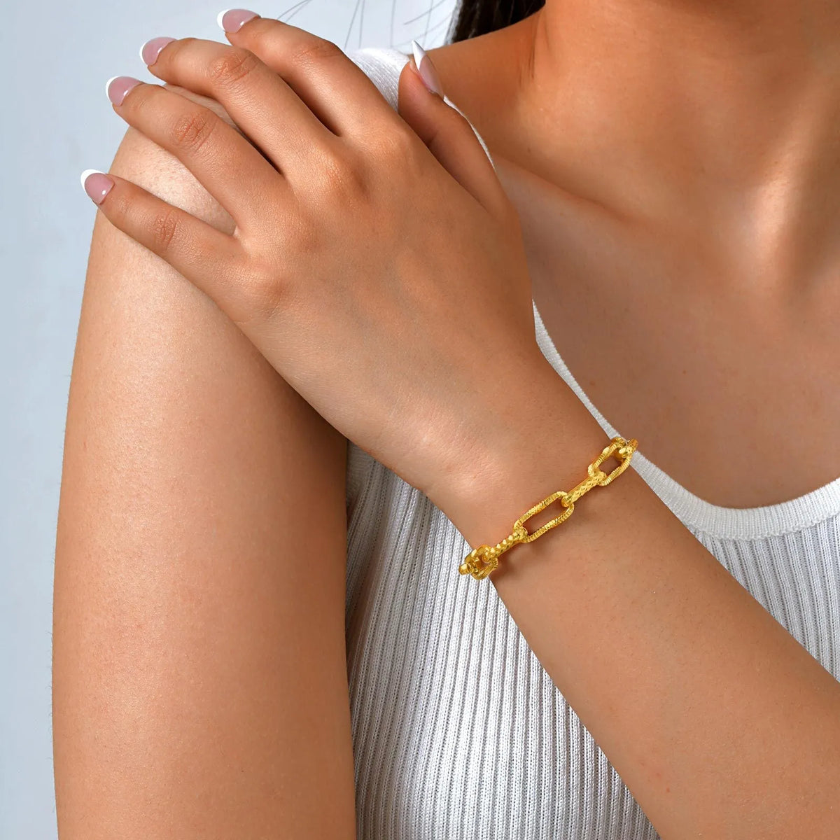 Gold electroplated titanium steel bracelet and necklace set with embossed rectangular geometric design for women