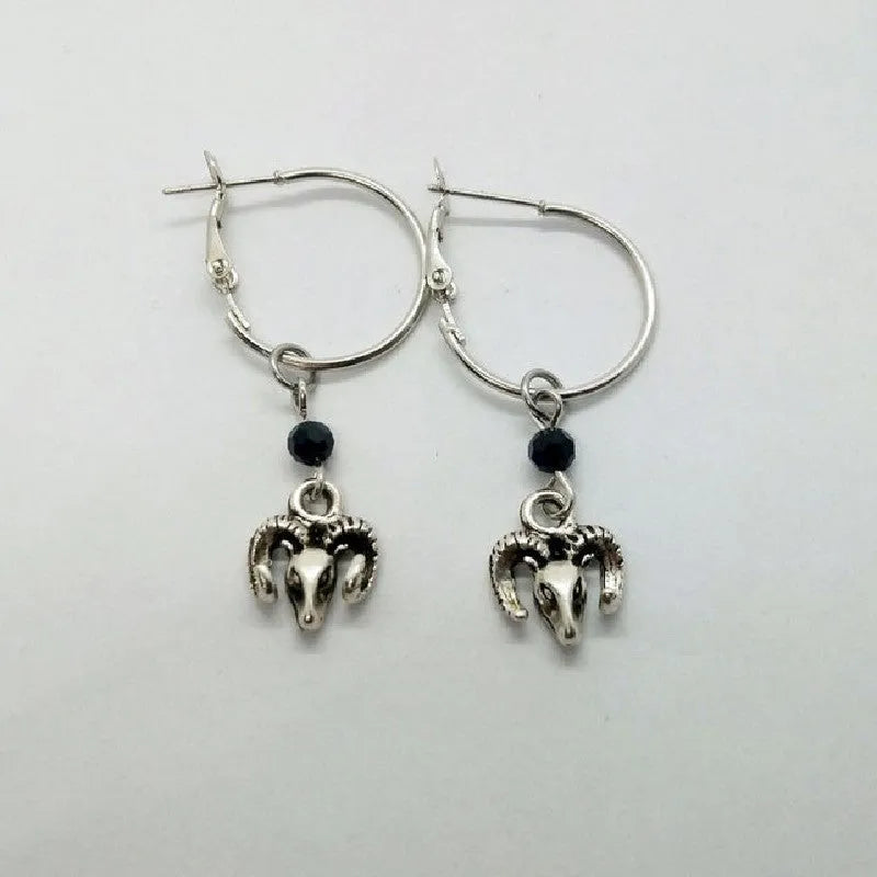 Silver round ring earrings for women with Tibetan antelope style design.