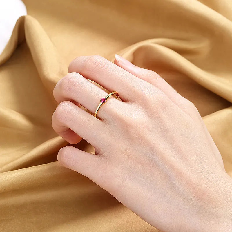 Women's geometric circle ring with single diamond in copper, showing colour options