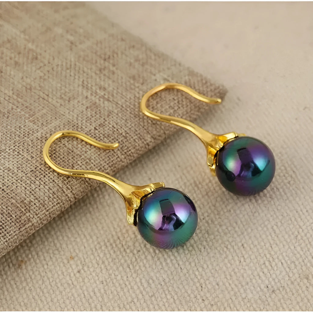 A pair of gold-coloured retro fashion alloy earrings for women with an electroplated finish.