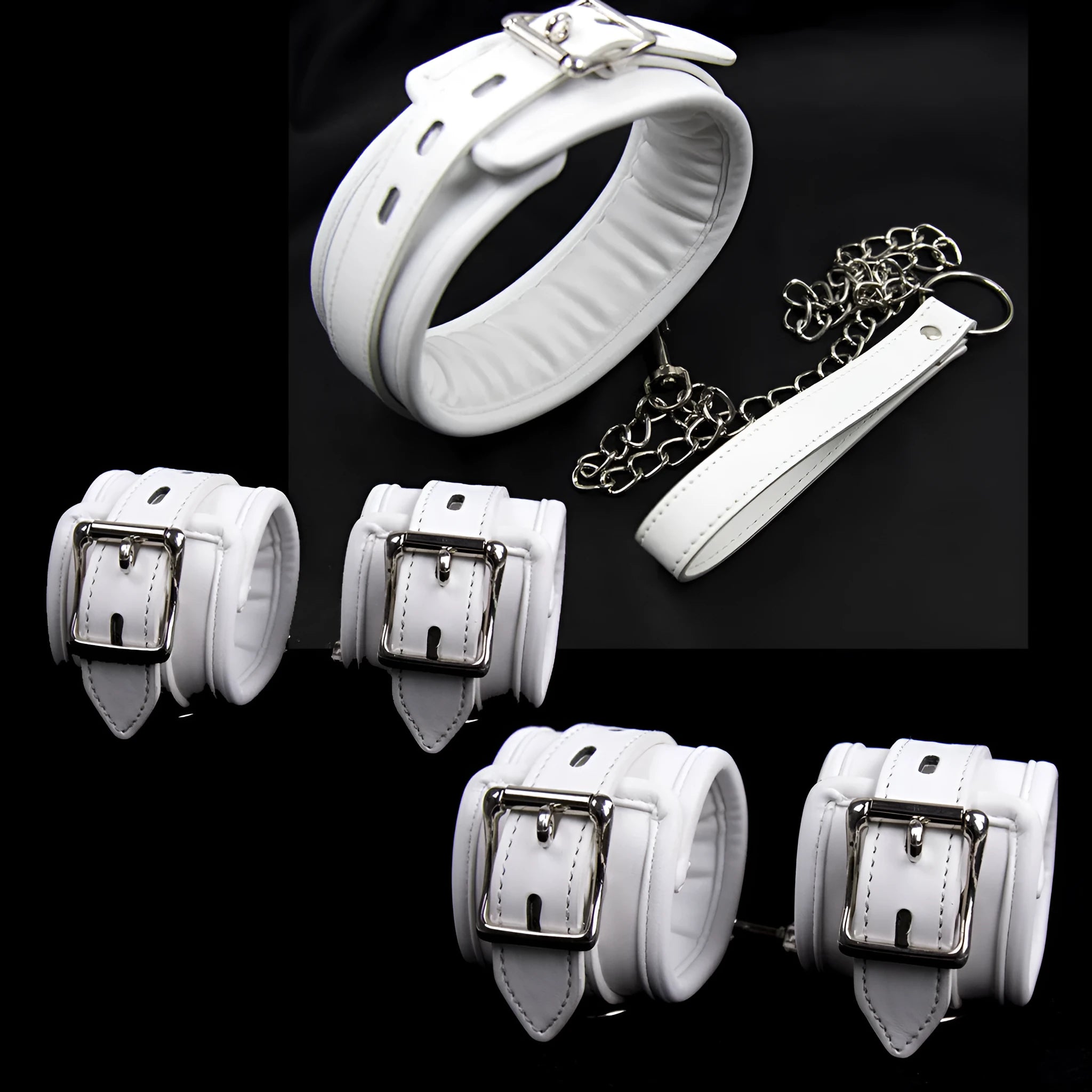 White PU sponge bondage set showing soft handcuffs, ankle cuffs, and a neck scarf laid out.
