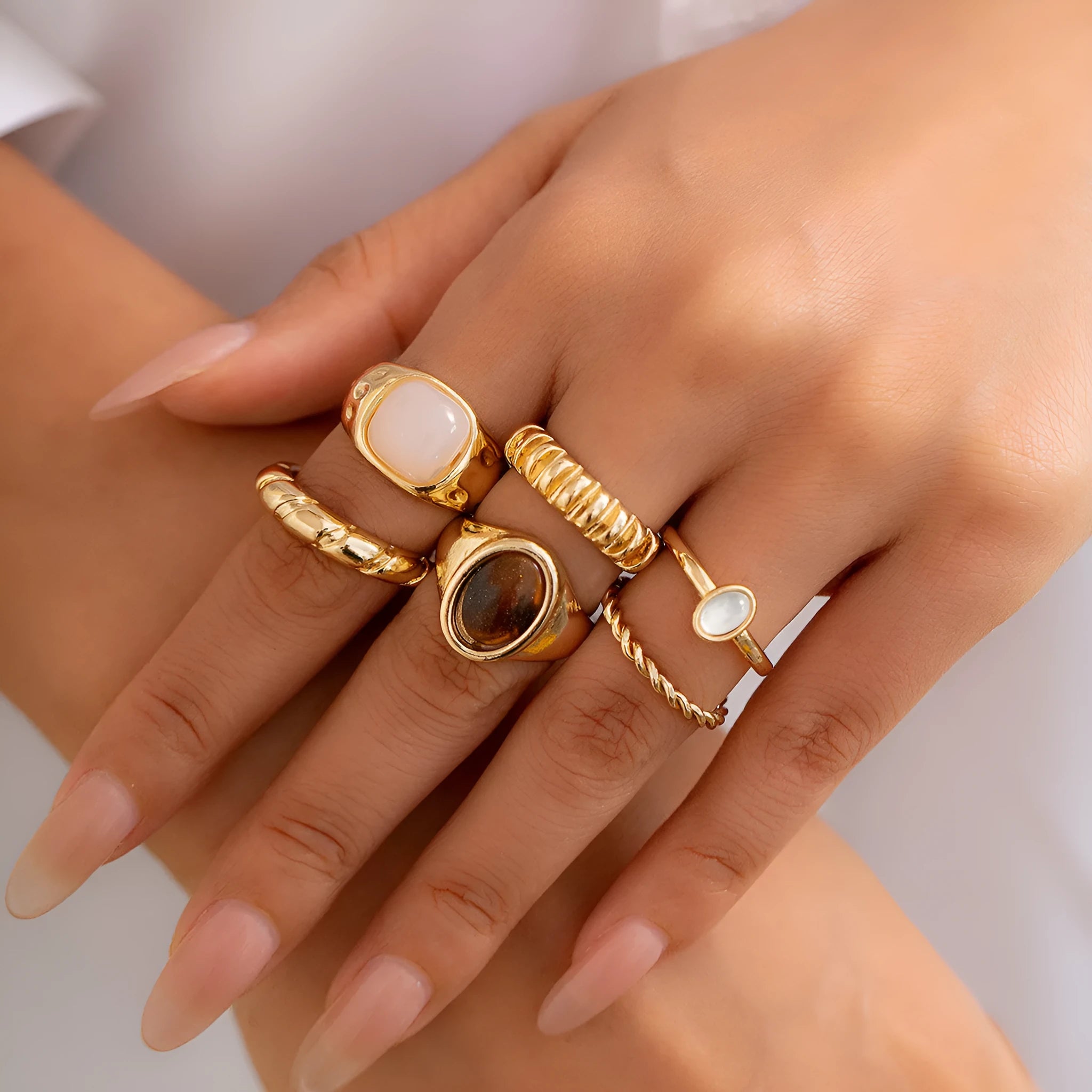 Set of six light gold geometric and round alloy rings with electroplated finish