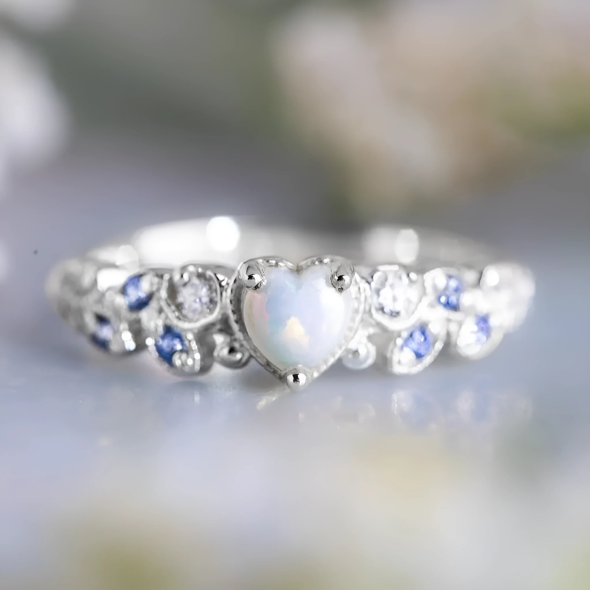 White alloy women's ring with a heart shape and floral opal ocean design details.
