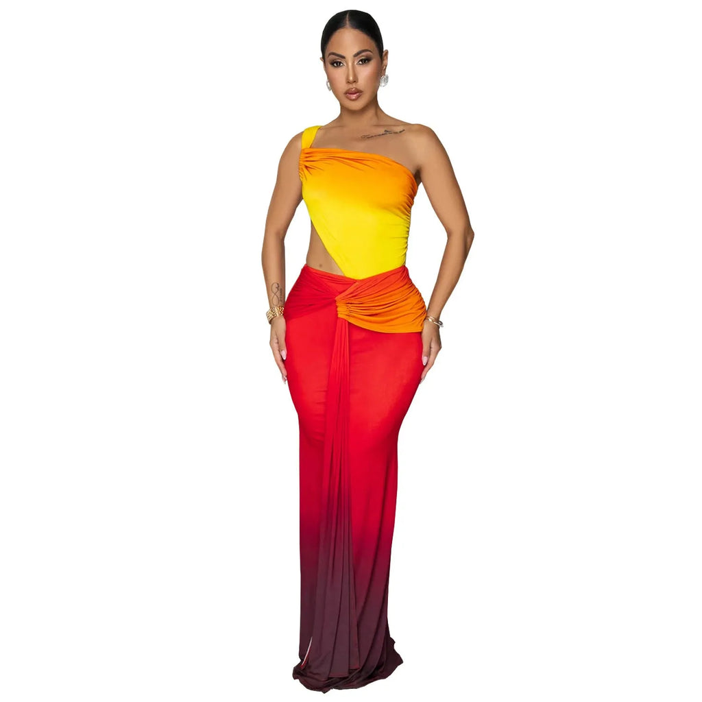 A woman's sleeveless cross-shoulder dress with a gradient colour long skirt.