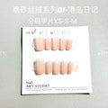 Set of false nails with frosted velvet finish and Cat's Eye designs in short ladder sizes XS, S, and M.