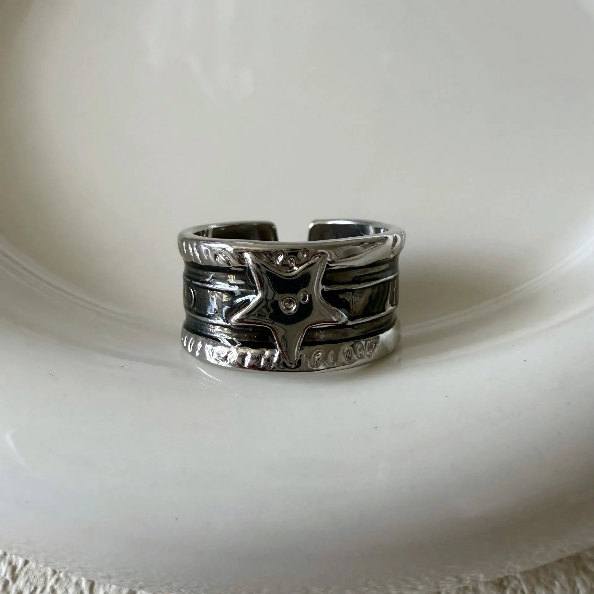XINGX geometric oil drop ring with adjustable band and distressed finish in multiple colours.