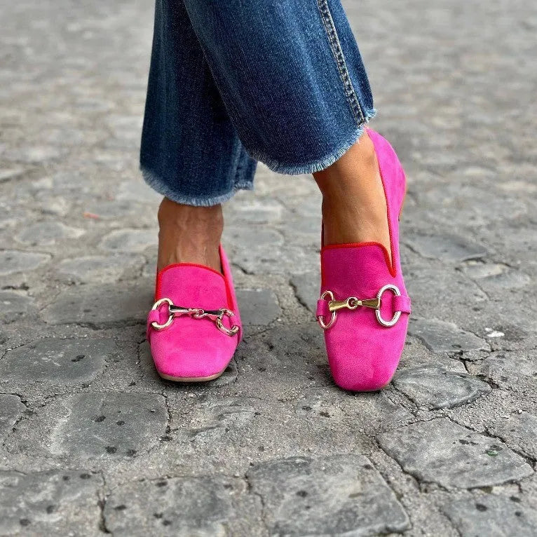 Green suede women's loafers with a metal fastener, flat rubber sole, and round toe.