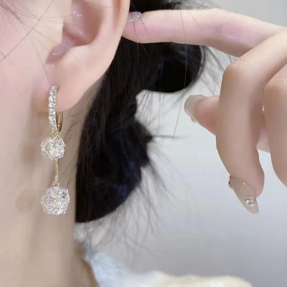Silver tassel ball earrings with rhinestone drops and confession balloon motifs on copper base