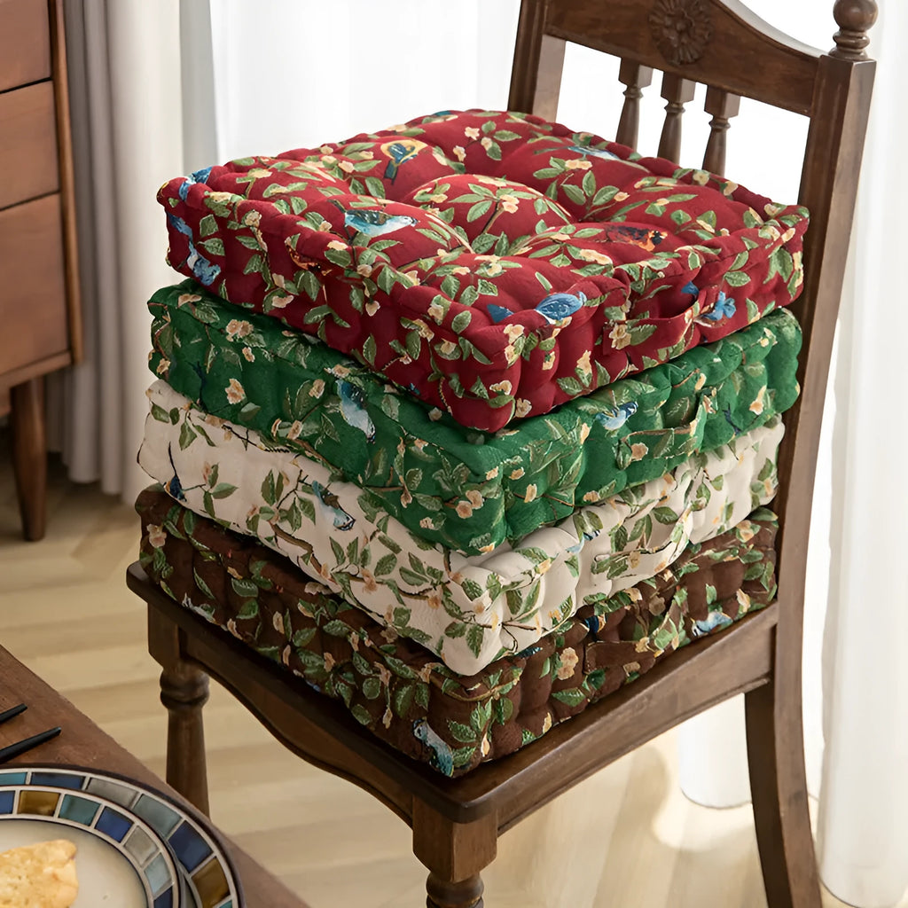 Square American-style dining chair cushion with pp cotton filler, shown in apricot floral bird print.