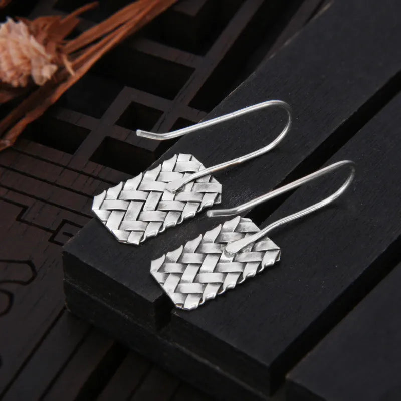 Silver geometric earrings with woven diamond plaid pattern, 17.5mm x 11mm dimensions