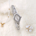 Gold or silver women's waterproof bracelet watch with 18mm dial and mineral glass mirror