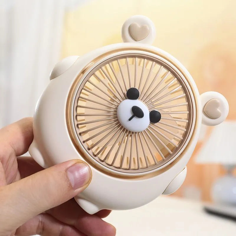 Cute dog-themed USB desktop electric fan showing three-speed controls and plastic construction
