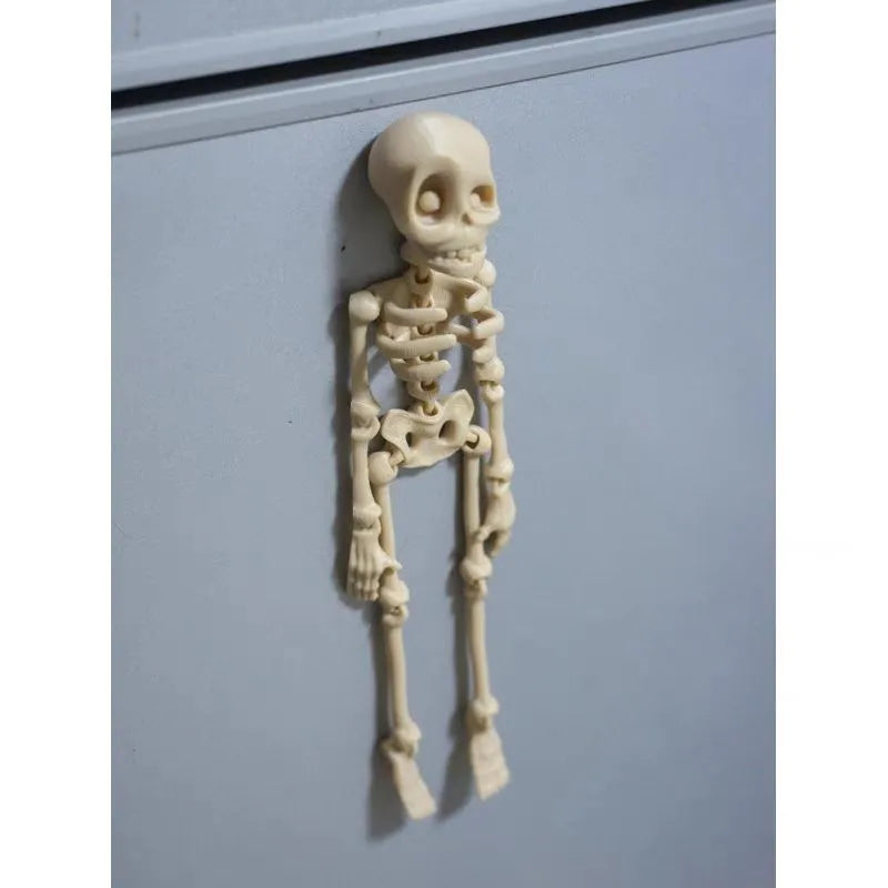 3D printed skull refrigerator magnet in multiple colours measuring 18cm high by 4.5cm wide