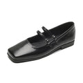 Women's silver leather Mary Jane flats with a cross-buckle ankle strap and round toe.
