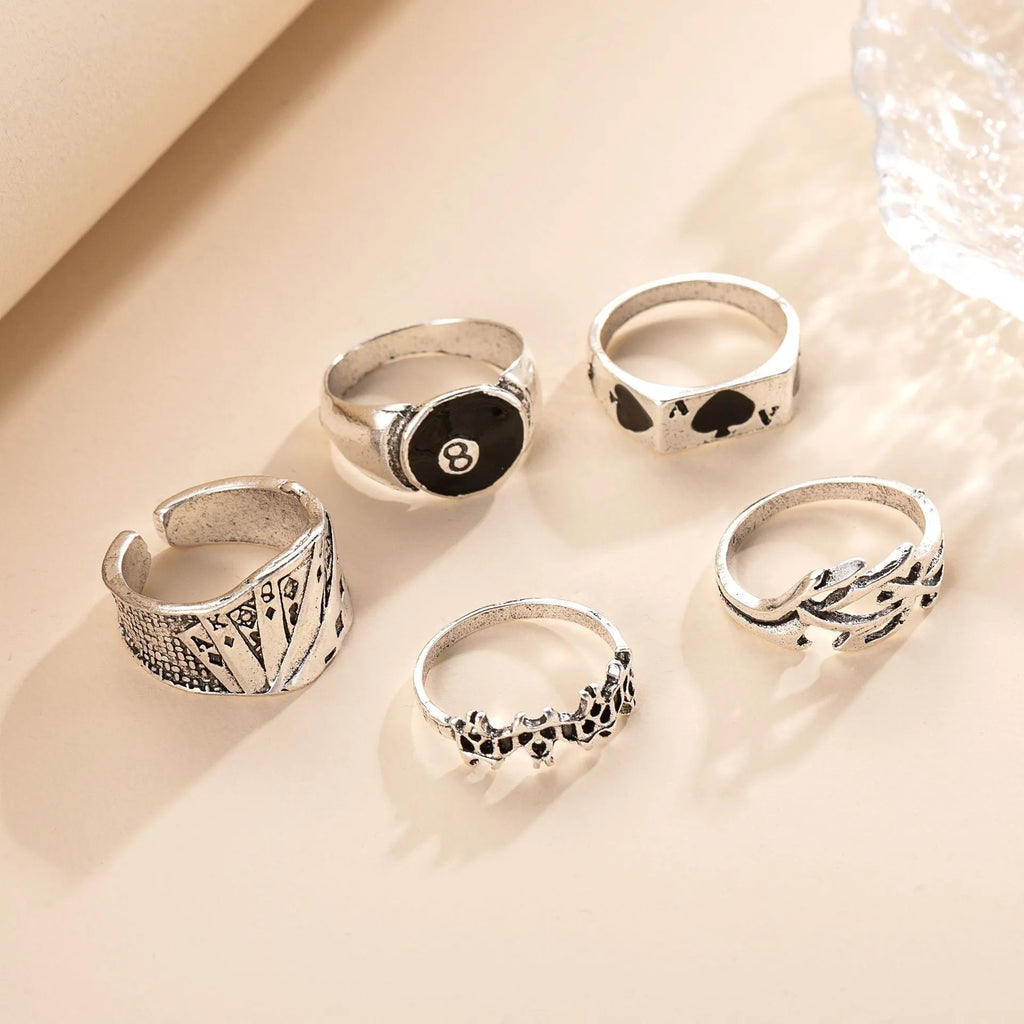 Black alloy poker ring with retro spade card design showing adjustable sizing feature