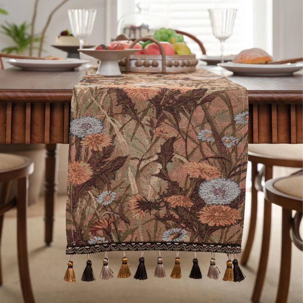 American-style beige jacquard table runner with long tassels and floral pattern on a dining table.