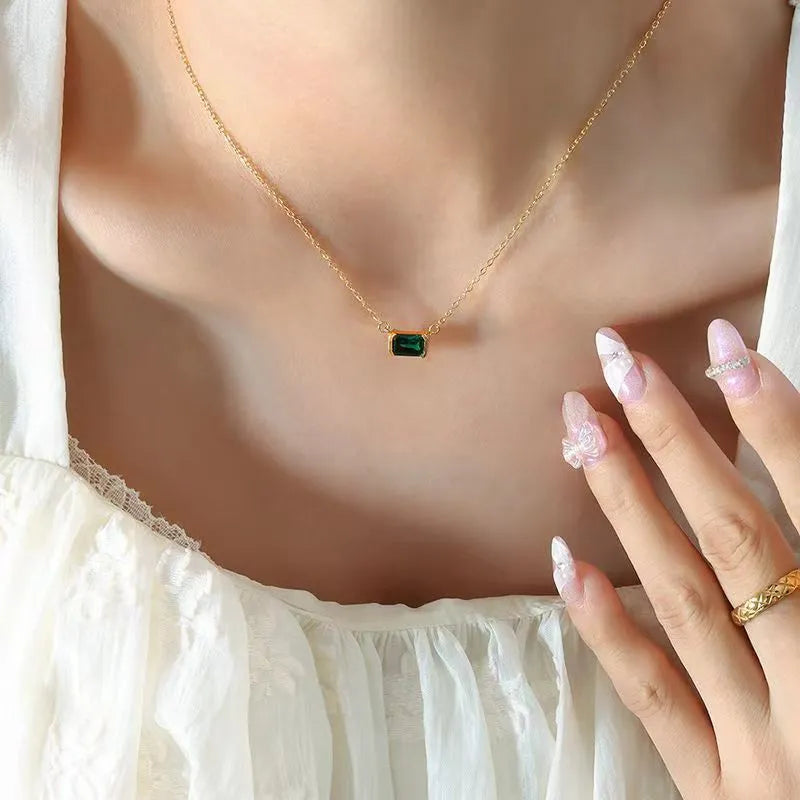 Gold geometric pendant necklace with a square Lvzuan stone inlay on a chain
