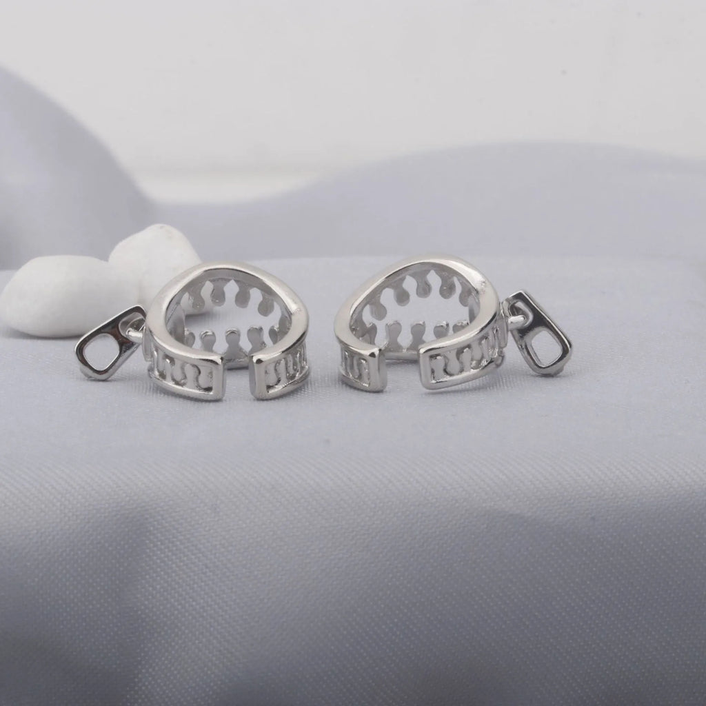A pair of geometric copper clip-on earrings with linear design in ES862 colour.