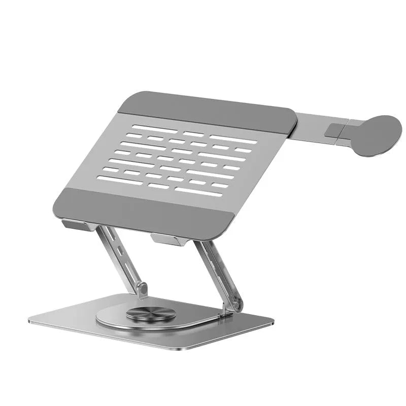 Silver carbon steel laptop stand with rotatable base and a side-mounted magnetic phone holder on a desk.