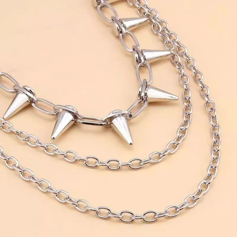 Silver double-layer metal pants chain with rivets and a zipper fastener, shown at full 115cm length.