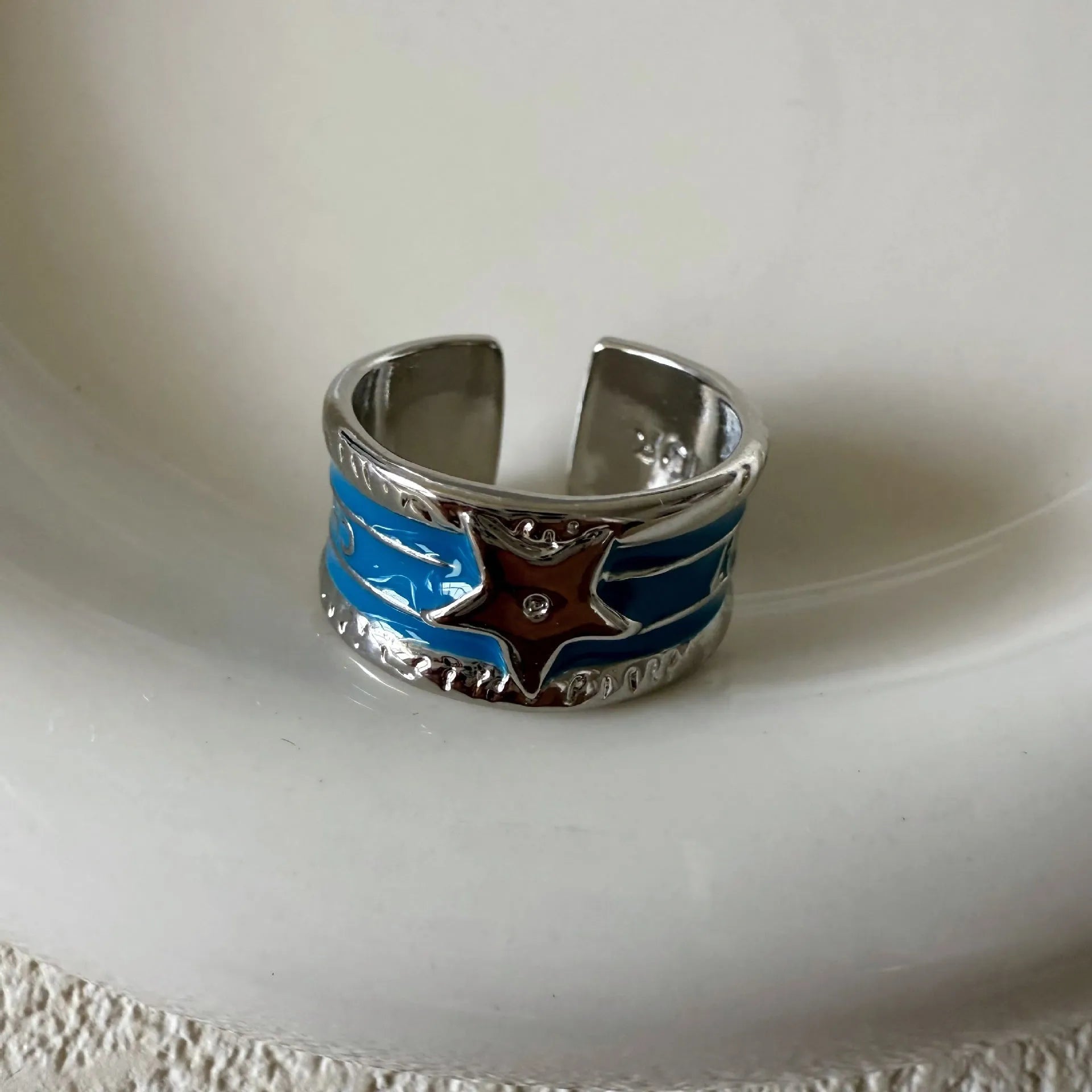 XINGX geometric oil drop ring with adjustable band and distressed finish in multiple colours.
