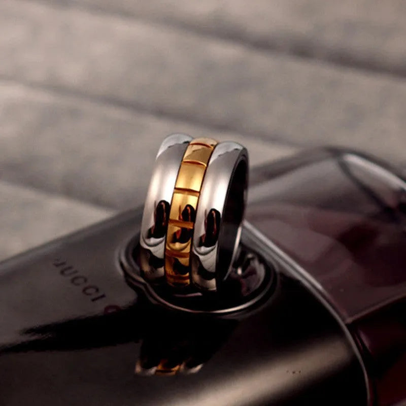 Gold titanium steel knuckle ring with ultra-wide rotatable band design