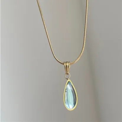 Retro water drop necklace for women with blue gemstone pendant on titanium steel snake bone chain.