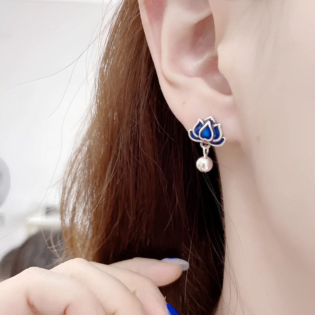 Blue lotus seedpod tassel ear studs with floral design on silver needle fittings