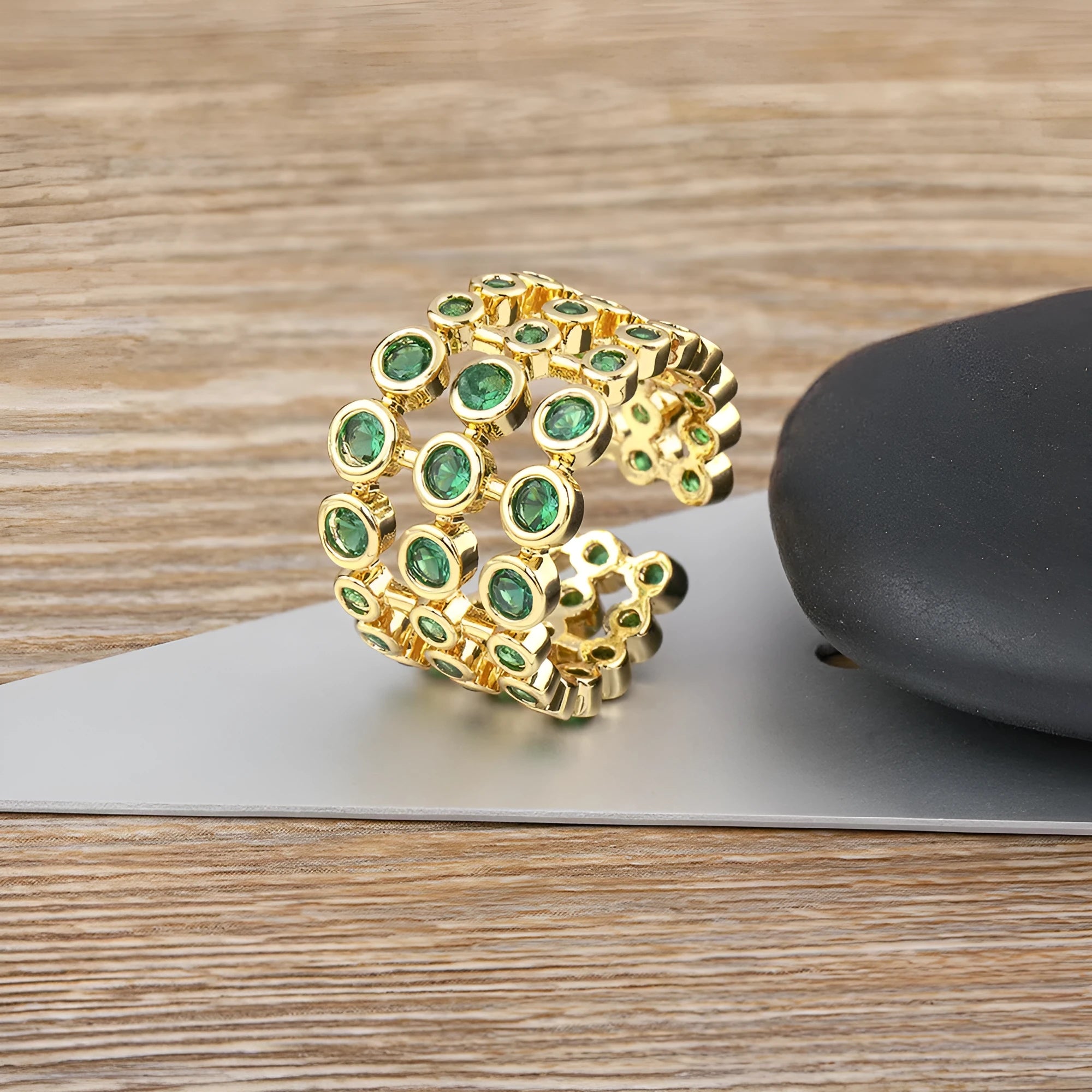Wide band gold ring with three-layer green zircon stone setting on copper base