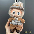 Plastic clothing costume for a 17cm tall vinyl doll figurine on display.