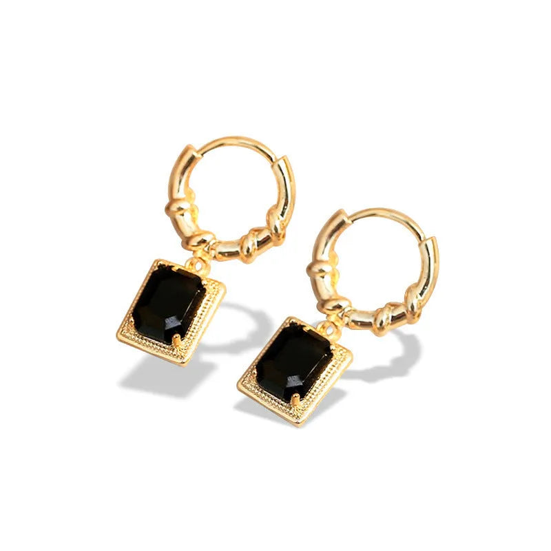 A pair of geometric black quadrilateral copper earrings with a zircon stone in a retro French court style.