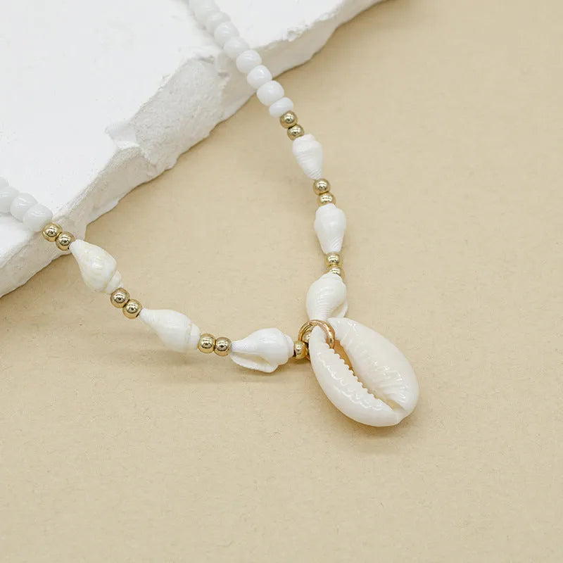 Conch white bead shell necklace with mother-of-pearl pendant on regular chain