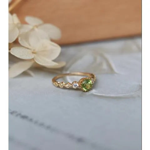 Copper geometric ring with quadrilateral design on a wooden background.