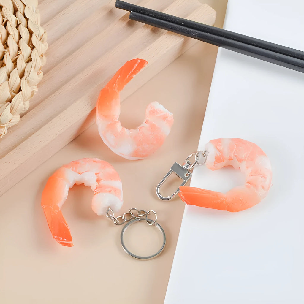 PVC simulation shrimp-shaped novelty keychain with door buckle, shown in modern simplicity style.