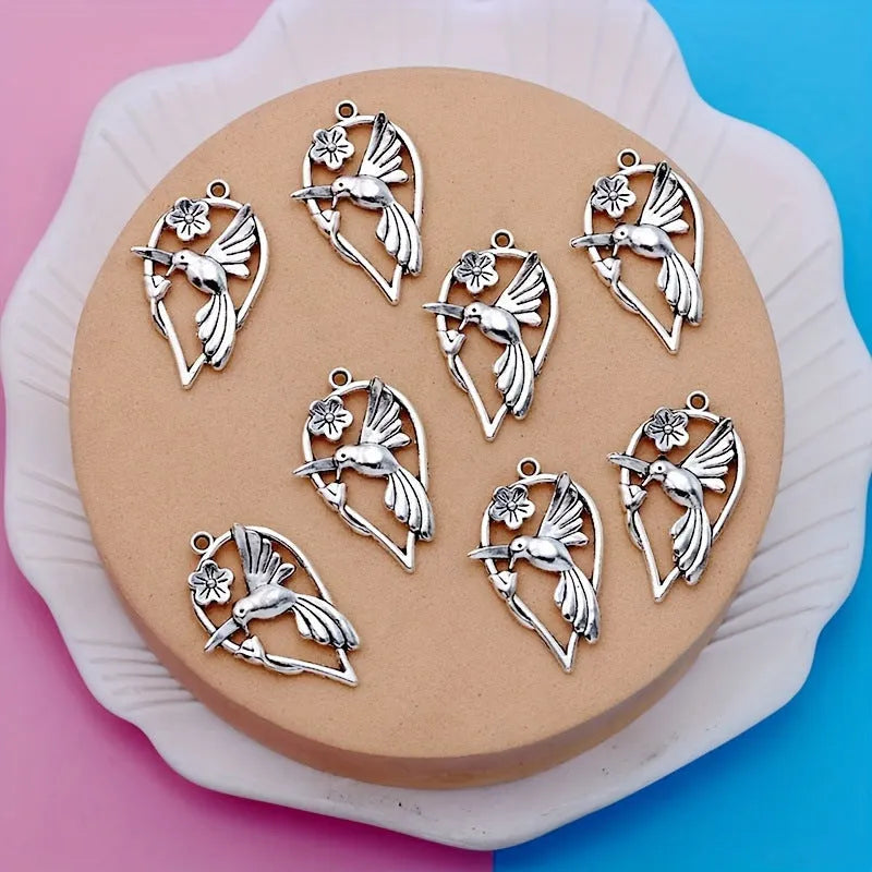Close-up of a detailed alloy cuckoo bird charm pendant with electroplated finish in colour P234.