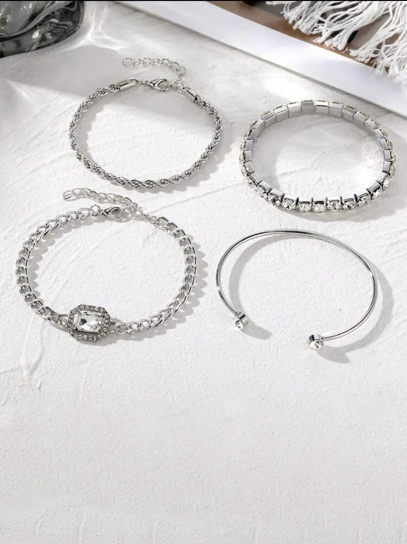 Retro geometric alloy four-piece jewellery set showing bracelet, earrings, necklace and ring with square diamond chain designs