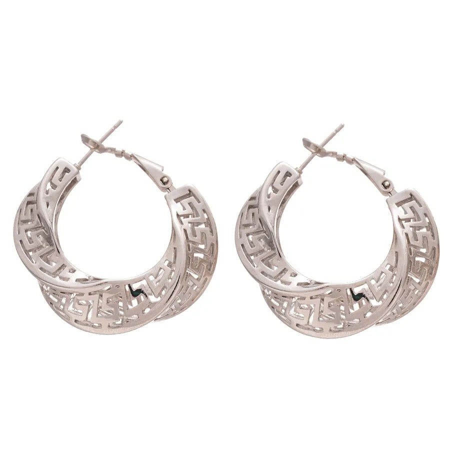 Geometric hollow stud earrings in gold and silver colours with twisted round design
