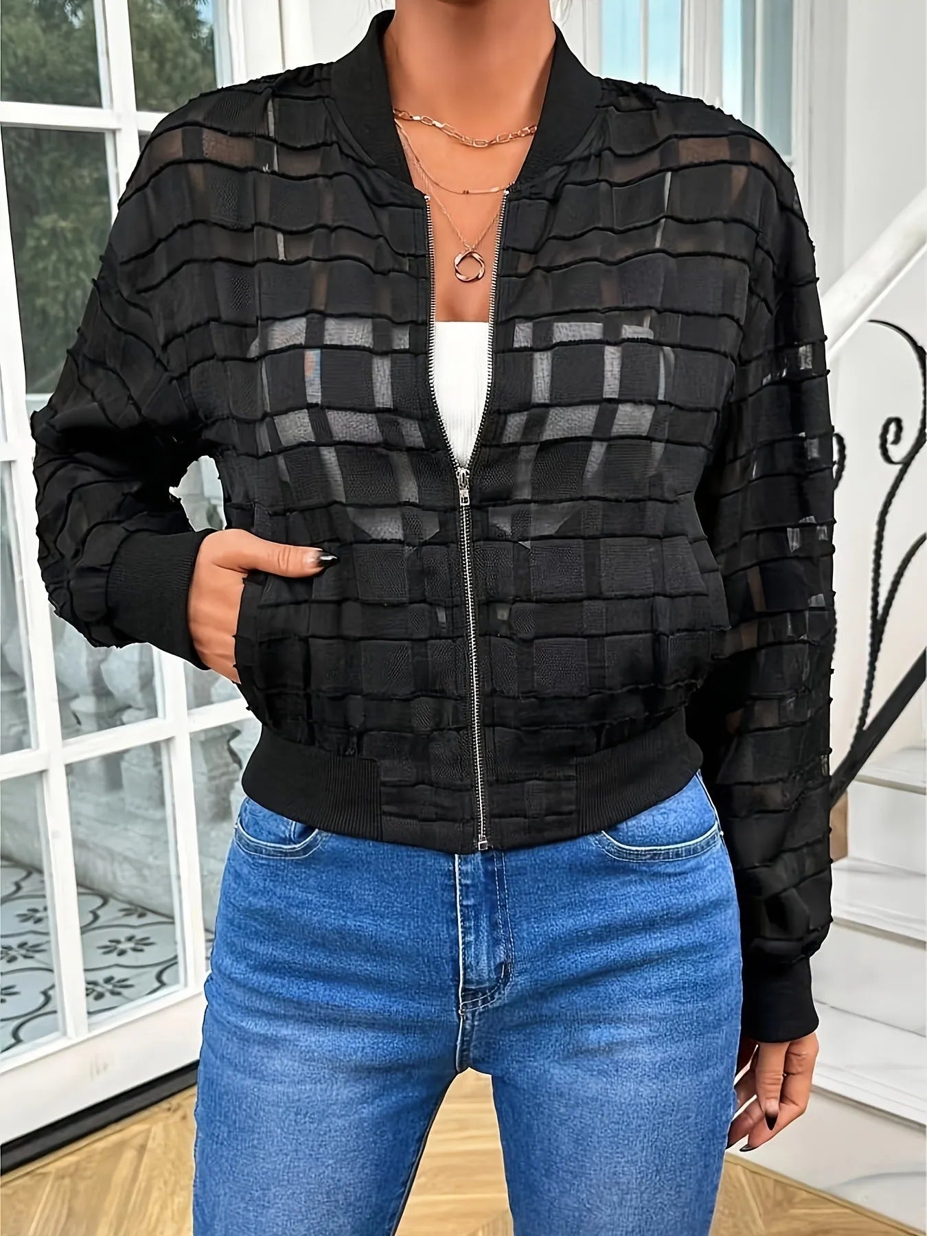 Black women's jacket with geometric pattern and front zipper