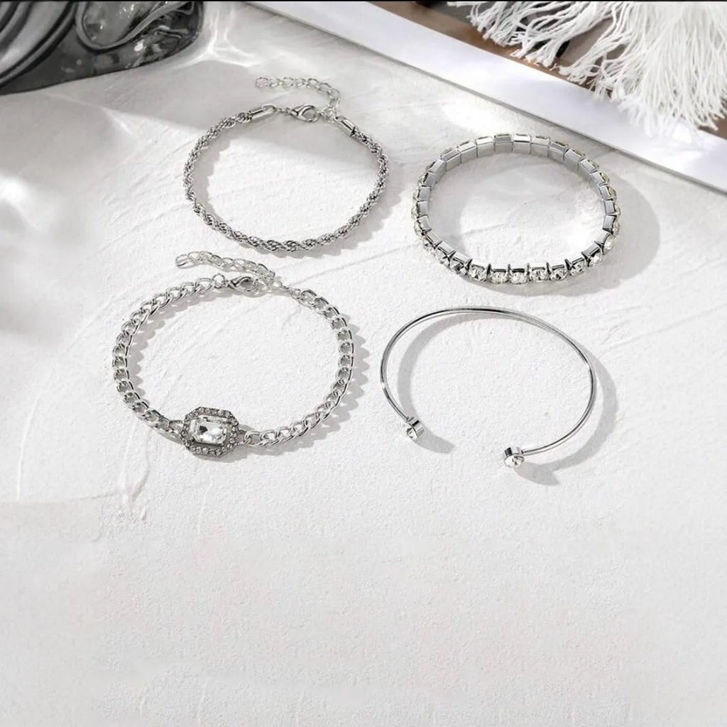 Retro geometric alloy four-piece jewellery set showing bracelet, earrings, necklace and ring with square diamond chain designs