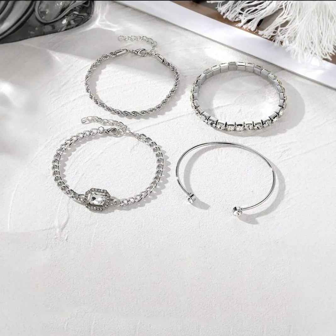 Retro geometric alloy four-piece jewellery set showing bracelet, earrings, necklace and ring with square diamond chain designs
