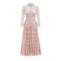 Women's black long sleeve beaded dress with mid waist and full-length skirt.