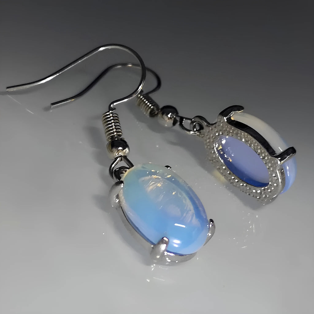 Women's opal earrings with cross pendant in drop shape and moonlight opal colour