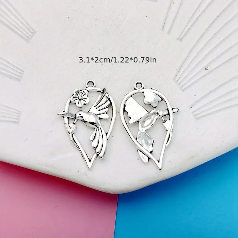 Close-up of a detailed alloy cuckoo bird charm pendant with electroplated finish in colour P234.